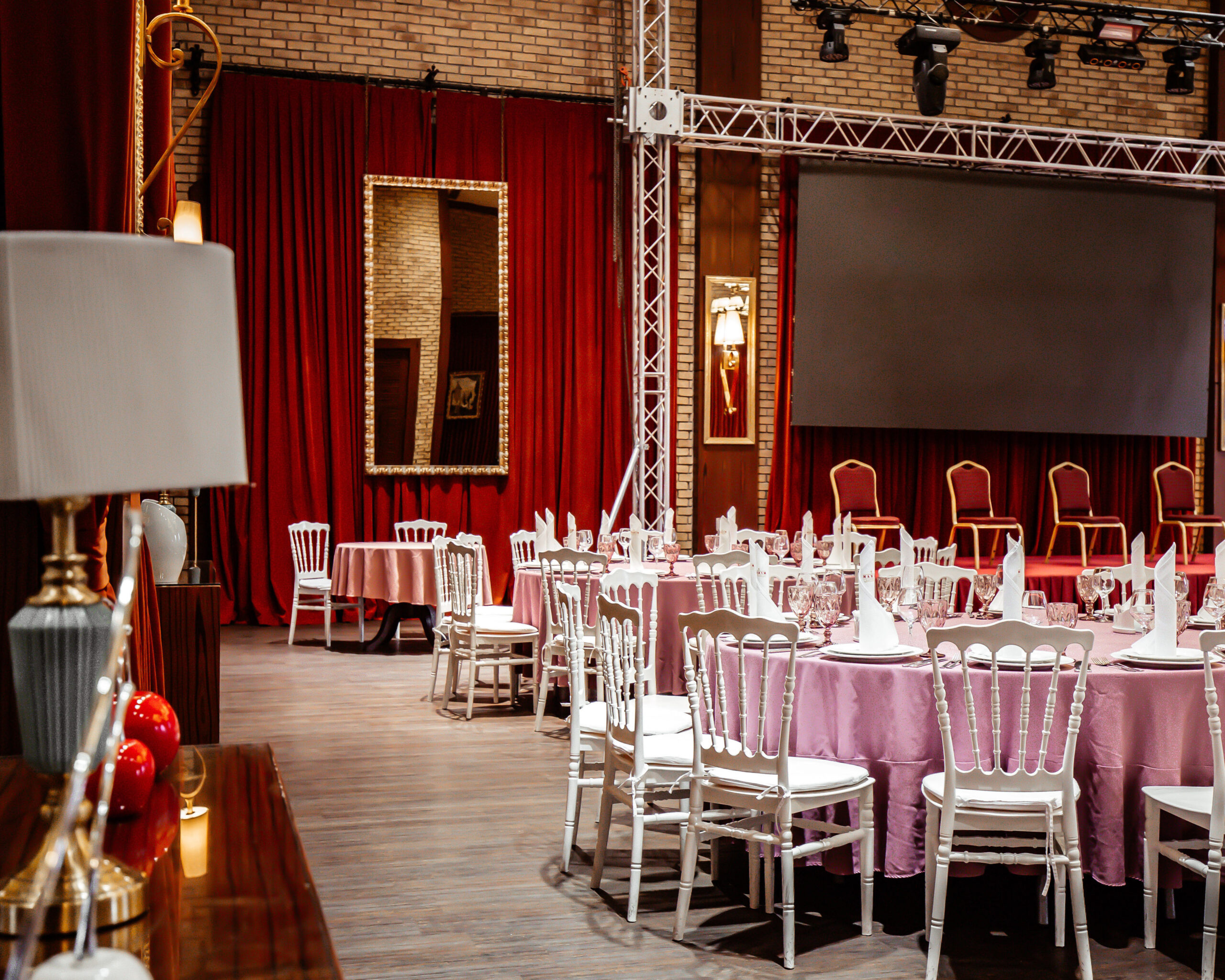 classic restaurant witn red curtains and stage